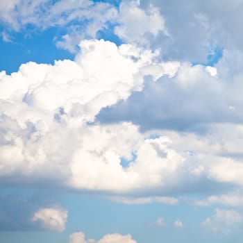 Blue summer sky with white clouds with copy space