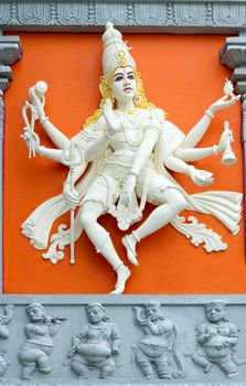 Hindu Goddess with Many Arms Statue on Wall of Sri Senpaga Vinayagar Temple