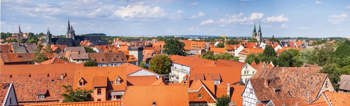 Bird's eye view of the tiled roofs of medieval houses in the historical center of europe city. Panoramic view