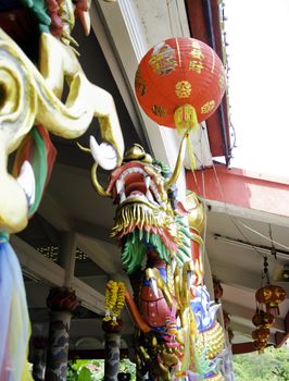Chinese style dragon statue at pole in temple