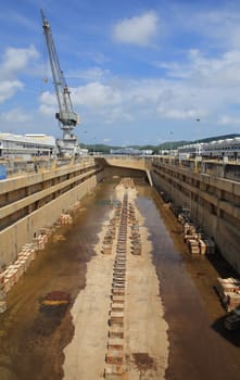 Crane near a covered dry dock at the shipyard