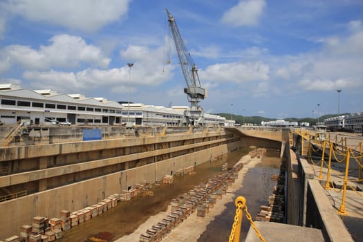 Crane near a covered dry dock at the shipyard