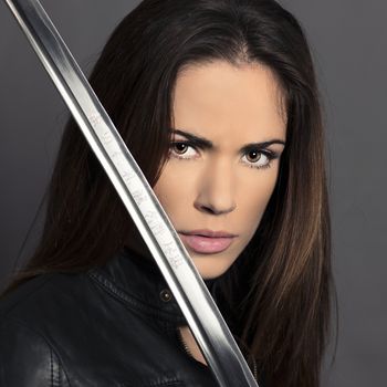 Portrait of girl with Katana in studio