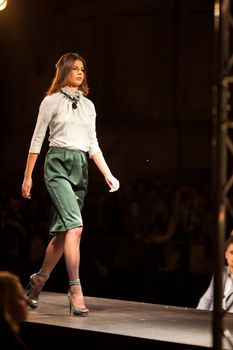 PRAGUE-SEPTEMBER 24: A model walks the runway during the 2011 autumn/winter Nina Ricci Paris Collection by Obsession during the Prague Fashion Weekend on September 24, 2011 in Prague, Czech Republic.