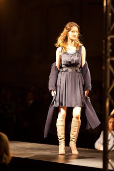 PRAGUE-SEPTEMBER 24: A model walks the runway during the 2011 autumn/winter Nina Ricci Paris Collection by Obsession during the Prague Fashion Weekend on September 24, 2011 in Prague, Czech Republic.