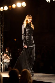 PRAGUE-SEPTEMBER 24: A model walks the runway during the 2011 autumn/winter Nina Ricci Paris Collection by Obsession during the Prague Fashion Weekend on September 24, 2011 in Prague, Czech Republic.