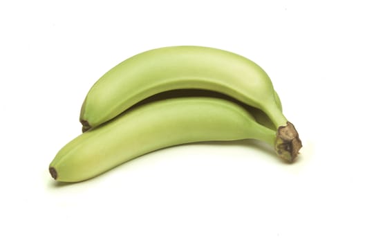 Two green bananas on a white background