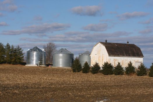 Old barn in winter in morning sun
