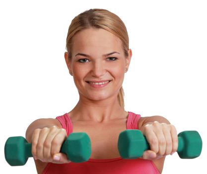 Portrait of a young blonde woman doing exercise with dumbbells isolated against a white background.