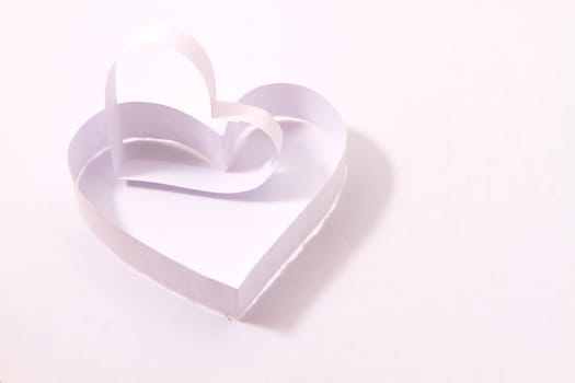Paper hearts on white background