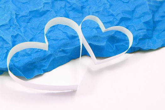 Paper hearts on blue background