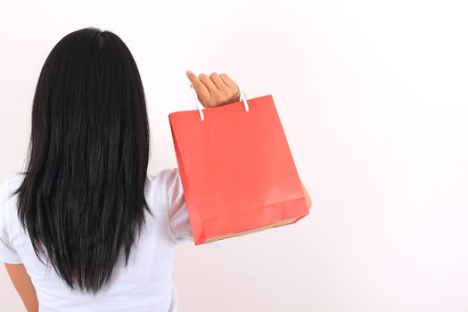 Young model with shopping bag in hands