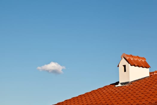 Beautiful Cloud and Dormer Window with Red Tiled Roof