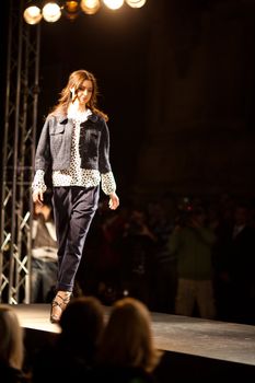 PRAGUE-SEPTEMBER 24: A model walks the runway during the 2011 autumn/winter Nina Ricci Paris Collection by Obsession during the Prague Fashion Weekend on September 24, 2011 in Prague, Czech Republic.