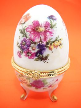 decorated egg with flowers on the red background