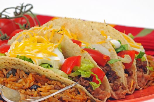 Tasty tacos served with mexican style rice.