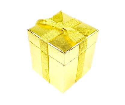 Golden shining gift box with ribbon isolated on white.