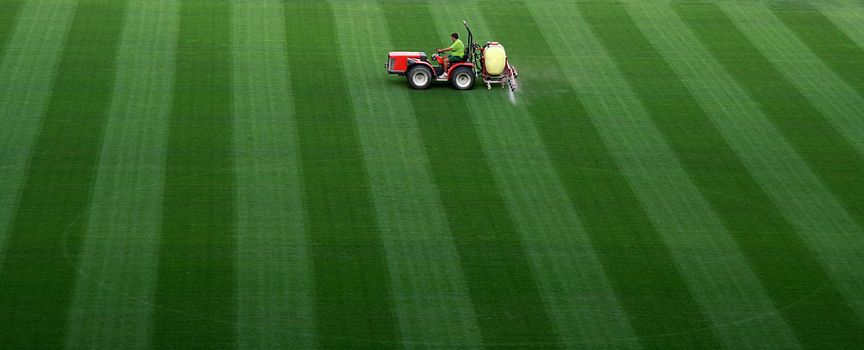 Sports field watering on Camp Nou stadium in Barcelona.