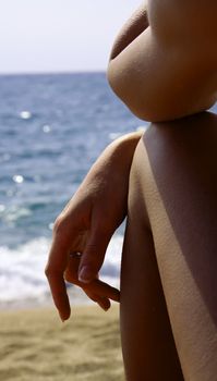Woman relaxing on a beach. Costa Brava.