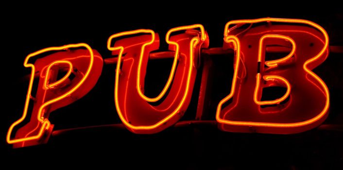Photo of a neon light sign saying Pub