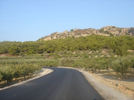 Turning road near mounting in Aegina island                               