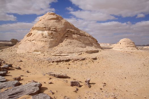 Wind and sand modeled rock sculptures in white desert