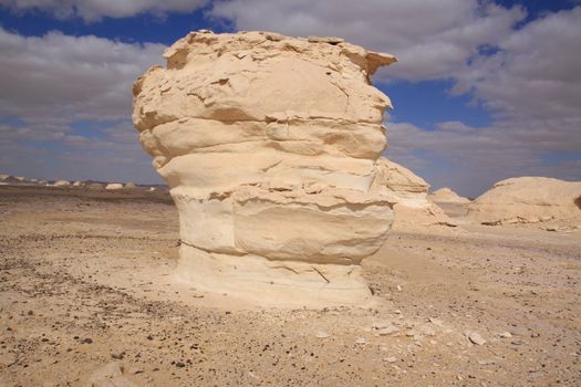 Wind and sand modeled rock sculptures in white desert