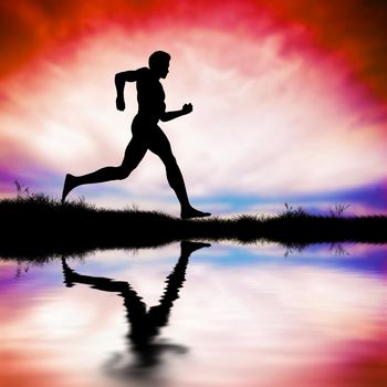 Silhouette of man running at sunset. Water reflection