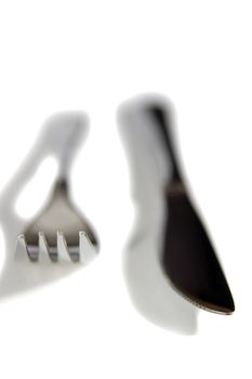 knife and fork with shadows isolated against a white background