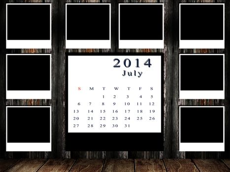 Calendar 2014 set with photo frame on grunge wall