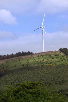 windmill on lush irish countryside landscape in glenough county tipperary ireland