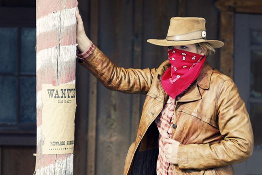 Portrait of a wanted cowgirl. Western movie style 