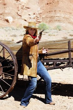 bad cowgirl with a gun in the hand