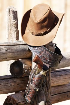 gun and hat under sunlight
