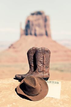 vintage wanted poster, boots and hat in Monument Valley