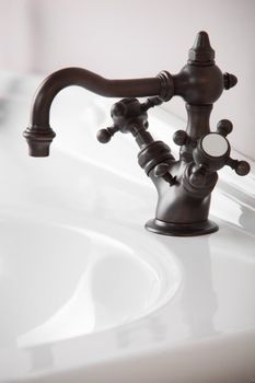 Brand new water tap on bright background