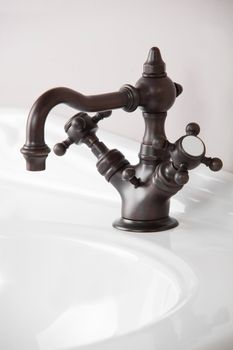 Brand new water tap on bright background