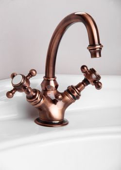 Brand new water tap on bright background