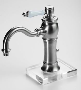 Brand new water tap on bright background