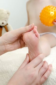 Therapist makes a child massage. Close-up
