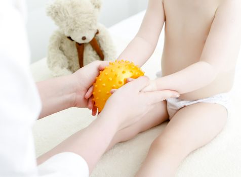 Therapist makes a child massage. Close-up