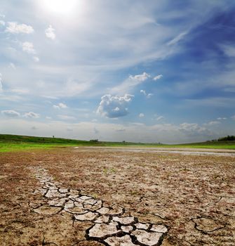 dramatic sky over dry cracked earth