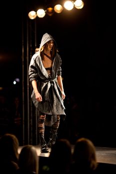 PRAGUE-SEPTEMBER 24: A model walks the runway during the 2011 autumn/winter Nina Ricci Paris Collection by Obsession during the Prague Fashion Weekend on September 24, 2011 in Prague, Czech Republic.