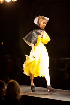 PRAGUE-SEPTEMBER 24: A model walks the runway during the 2011 autumn/winter Nina Ricci Paris Collection by Obsession during the Prague Fashion Weekend on September 24, 2011 in Prague, Czech Republic.