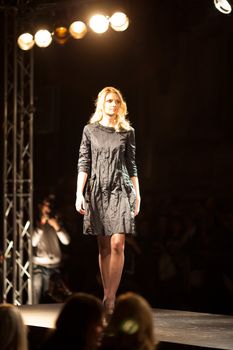 PRAGUE-SEPTEMBER 24: A model walks the runway during the 2011 autumn/winter Nina Ricci Paris Collection by Obsession during the Prague Fashion Weekend on September 24, 2011 in Prague, Czech Republic.