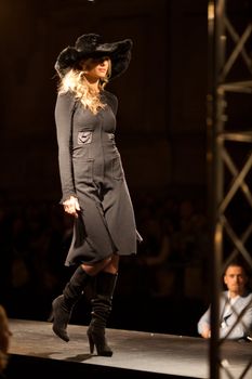 PRAGUE-SEPTEMBER 24: A model walks the runway during the 2011 autumn/winter Nina Ricci Paris Collection by Obsession during the Prague Fashion Weekend on September 24, 2011 in Prague, Czech Republic.