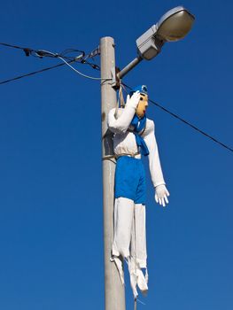 dummy hanging on the post