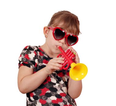 little girl with sunglasses play trumpet