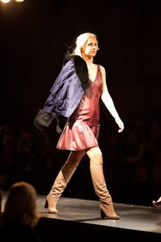 PRAGUE-SEPTEMBER 24: A model walks the runway during the 2011 autumn/winter Nina Ricci Paris Collection by Obsession during the Prague Fashion Weekend on September 24, 2011 in Prague, Czech Republic.