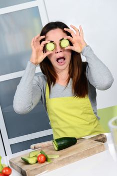 Young Woman Cooking. Healthy Food - Vegetable Salad. Diet. Dieting Concept. Healthy Lifestyle. Cooking At Home. Prepare Food 